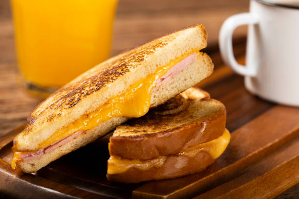 istock Grilled ham and cheese. Sandwich with cheese and ham on grill. 1313740000