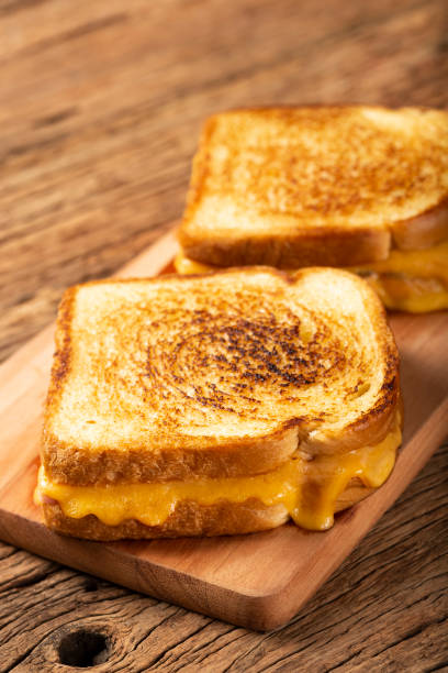 istock Grilled ham and cheese. Sandwich with cheese and ham on grill. 1313740004