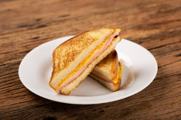 istock Grilled ham and cheese. Sandwich with cheese and ham on grill. 1313740009