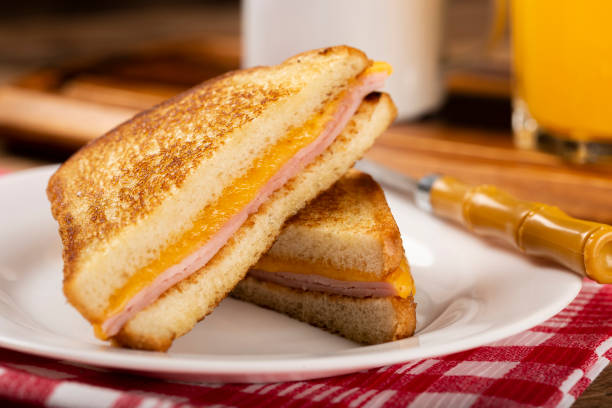 istock Grilled ham and cheese. Sandwich with cheese and ham on grill. 1313740013