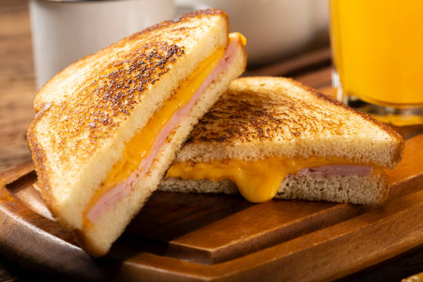 istock Grilled ham and cheese. Sandwich with cheese and ham on grill. 1313740015