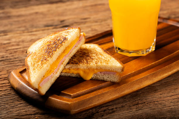 istock Grilled ham and cheese. Sandwich with cheese and ham on grill. 1313740019