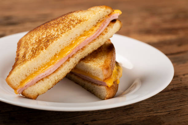 istock Grilled ham and cheese. Sandwich with cheese and ham on grill. 1313740020