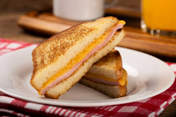 istock Grilled ham and cheese. Sandwich with cheese and ham on grill. 1313740033