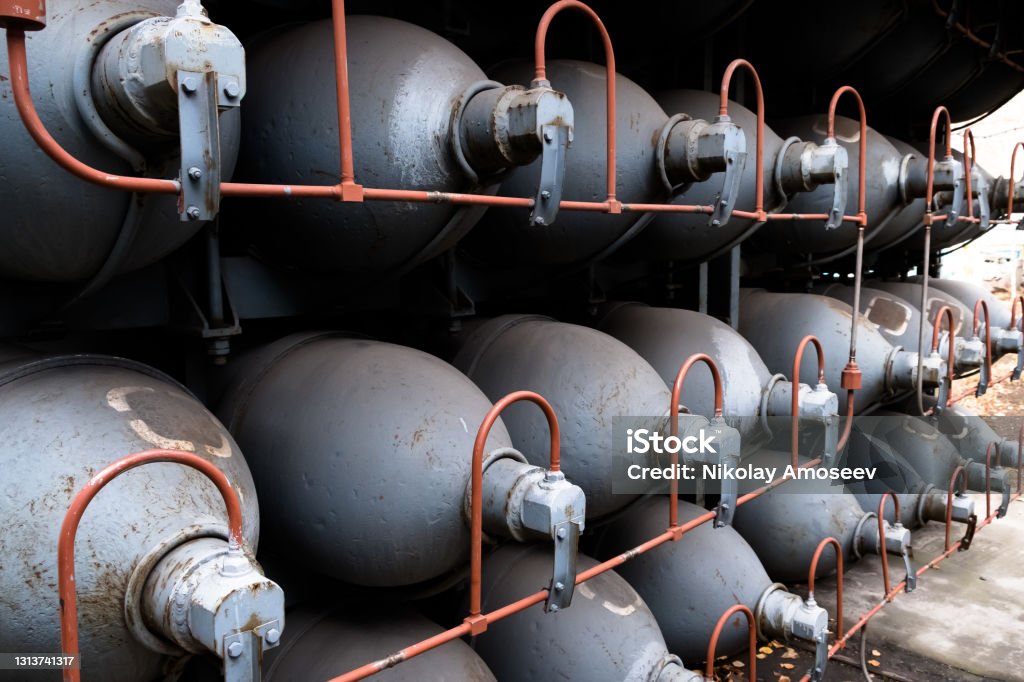 Helium high capacity gas cilinders. Tanks with compressed gas for industry. Liquefied oxygen production. Factory Helium high capacity gas cilinders. Tanks with compressed gas for industry. Liquefied oxygen production. Factory. Helium Stock Photo