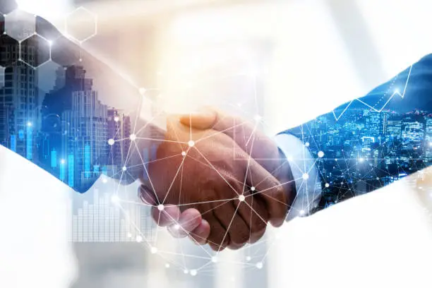 Photo of Business Partnership. business man investor handshake with effect global network link connection and graph chart of stock market graphic diagram, digital technology, internet and partnership concept