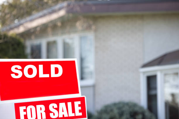 istock House Sold Sign in the Suburb 1313742384