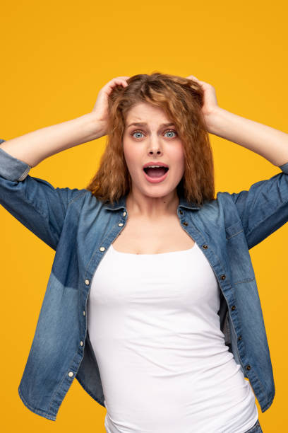 istock Anxious young woman with hands on head 1313744308