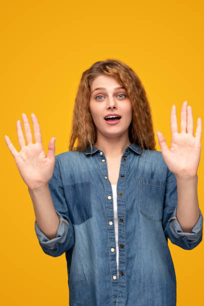 istock Surprised woman holding hands up in stop gesture 1313744309