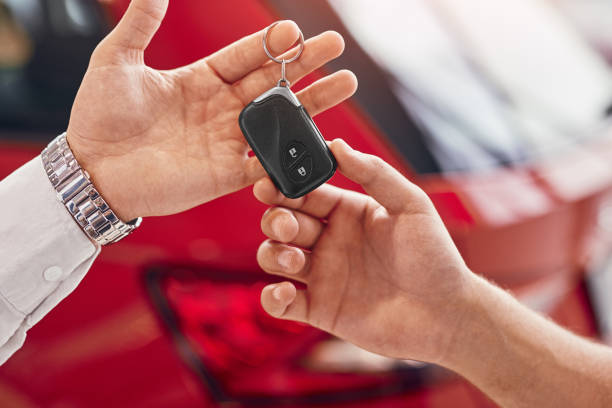 istock Manager giving car keys to client 1313744384