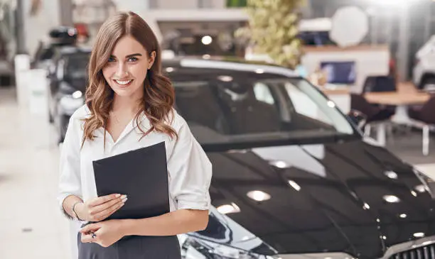 Photo of Female manager in car dealership