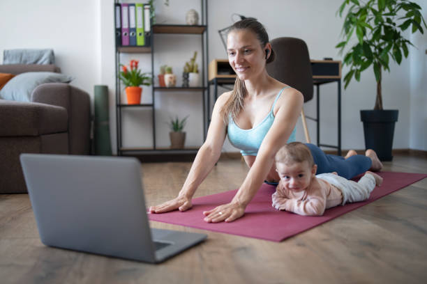 istock Young mother practicing yoga with her baby. 1313744672