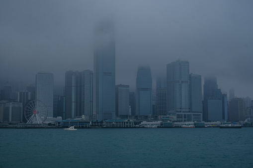 The island of Hong Kong is covered in the mist. This usually happens at the end of winter and when monsoon clouds frequent the city more and more often.