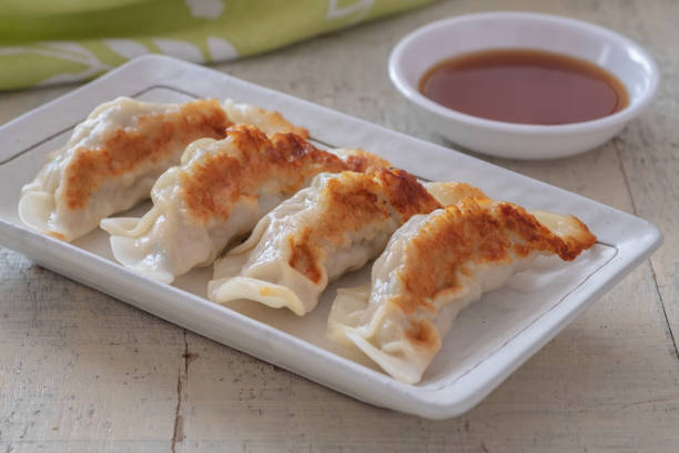istock Fried dumplings Gyoza on plate and soy sauce 1313751742
