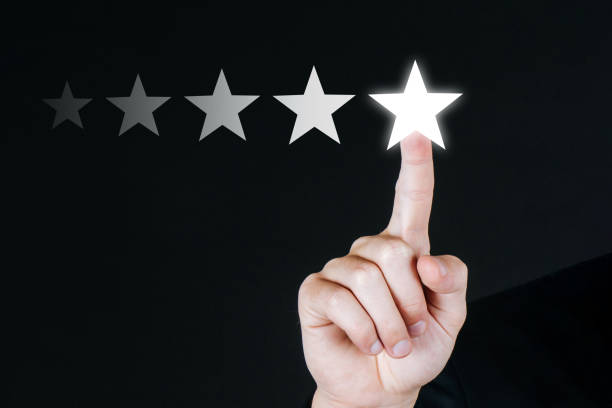 istock 5 star rating. business customer hand pressing five star button on visual screen to review good rating with copy space on dark background, good experience, positive thinking, customer feedback concept 1313754382
