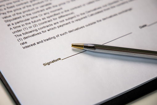 Business agreement signing document And a pen for business people