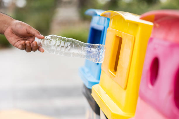istock A young man drinks from plastic bottles and throws them into the trash. Video about environmental day Separate plastic waste in the correct category. Public trash 1313759798