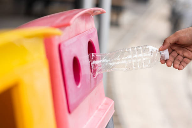 istock A young man drinks from plastic bottles and throws them into the trash. Video about environmental day Separate plastic waste in the correct category. Public trash 1313759831