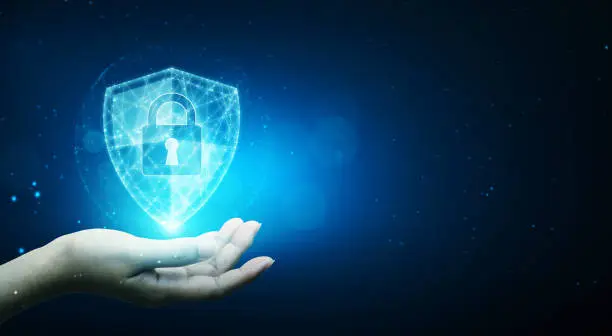 Photo of Protection network cyber security computer and safe your data concept, Businessman holding shield protect icon