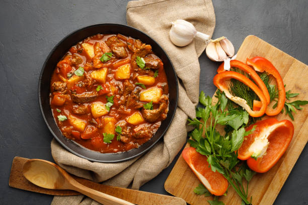 istock Goulash, beef stew with vegetables in tomato sauce 1313768464
