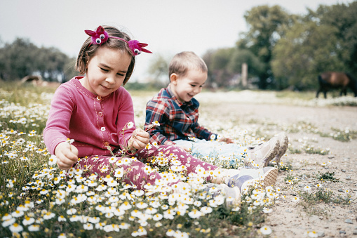 Portrait Of Child Boy And Girl Outdoors In Spring Season