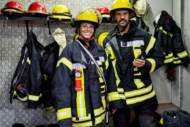 istock Portrait of Two Fire Company Members in Protective Workwear 1313773477