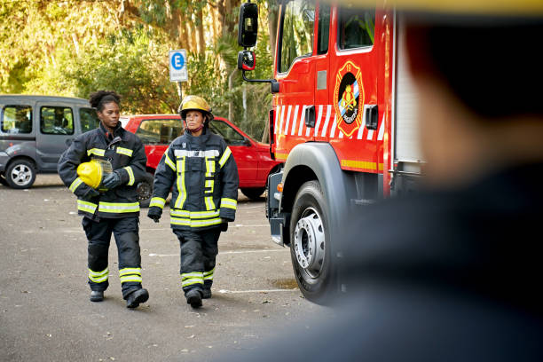 istock Mid Adult Female Firefighters in Protective Workwear 1313773495