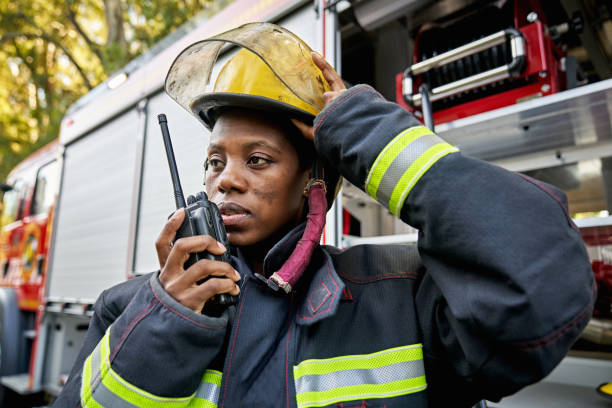istock Black Female Firefighter Using Walkie-Talkie 1313773504