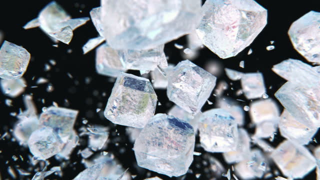 Jumping frosted fresh ice cubes in 4K Slow motion