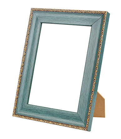 Empty large dark green wooden frame for photo or artwork with decorative golden border on stand isolated on white background