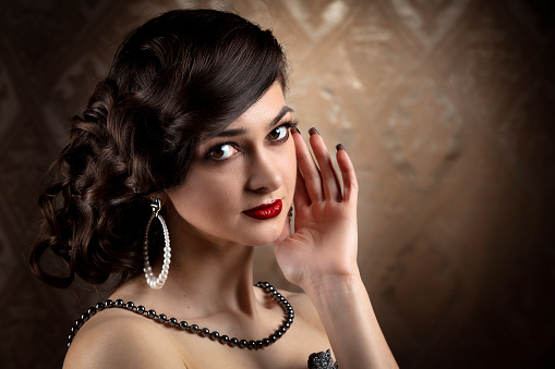 Retro woman portrait. Luxurious lady in vintage style from 20s or 30s.