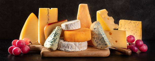 istock Cheese panorama with various types of cheeses, side view 1313781476