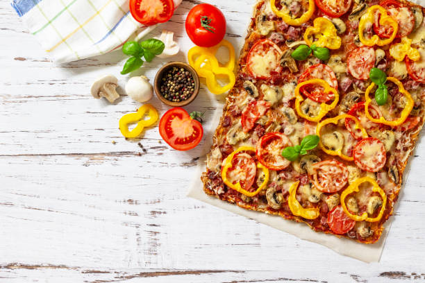 istock Home made baking. Detroit-Style Pizza. Large rectangular Pepperoni pizza with tomatoes, salami and cheese on a rustic wooden table. Top view. Flat lay. Copy space. 1313781646