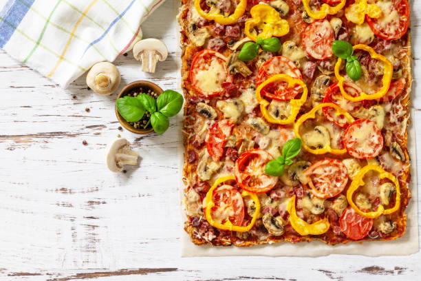 istock Home made baking. Detroit-Style Pizza. Large rectangular Pepperoni pizza with tomatoes, salami and cheese on a rustic wooden table. Top view. Flat lay. Copy space. 1313781665