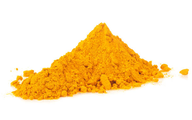 Dry turmeric powder isolated on a white background. Pile of curcuma powder. Dry turmeric powder isolated on a white background. Pile of curcuma powder. food coloring stock pictures, royalty-free photos & images