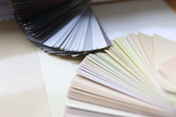 Multi-colored color palettes with swatches lie on table. Selection of color solutions concept