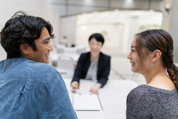 istock Asian married couple consulting with agent 1313782670