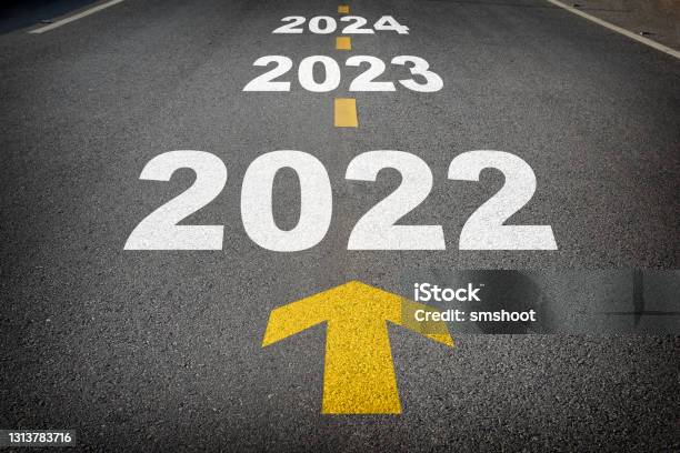New Year 2022 To 2024 And Yellow Arrow On Asphalt Road Stock Photo - Download Image Now