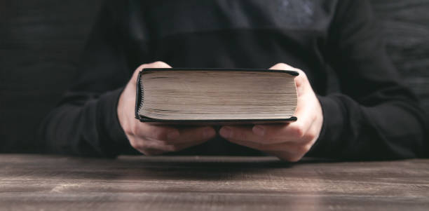 istock Caucasian man holding bible. Religion 1313784820