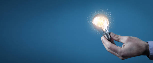 istock Man holding light bulb and human brain. Brainstorming. Idea 1313784846