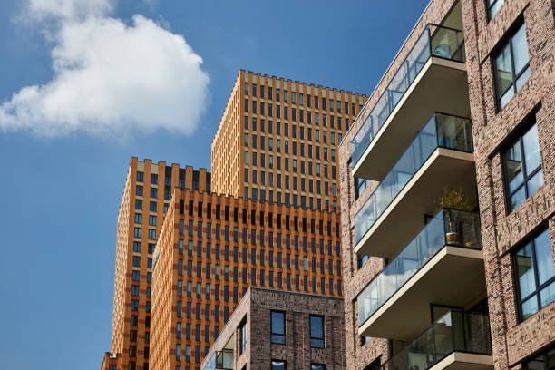 Business district with tall modern office buildings at Amsterdam Zuid Business district with modern tall office buildings at Amsterdam Zuid, Amsterdam, The Netherlands highrise condominiums stock pictures, royalty-free photos & images