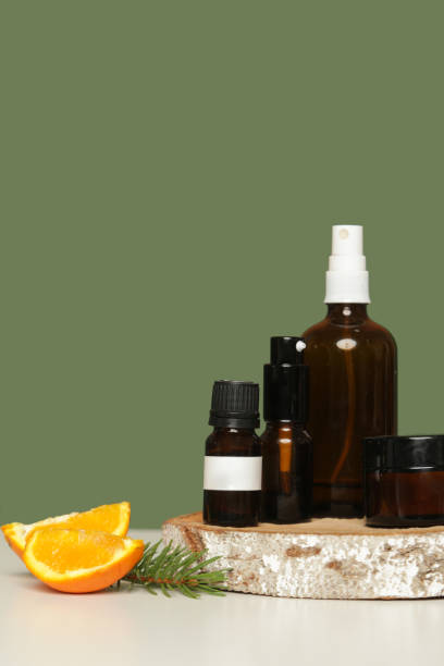 istock Various brown glass cosmetics bottles on green background 1313787487