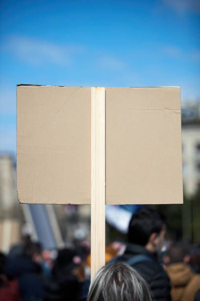 istock Protesters holding placards and signs on the streets. 1313788529