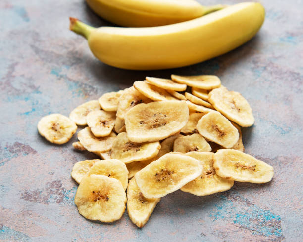 istock Dried candied banana slices or chips 1313788876
