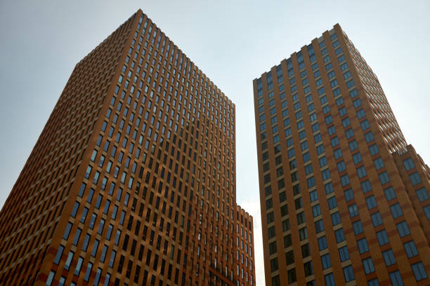 Ground level view of a tall office building. Perspective correction.