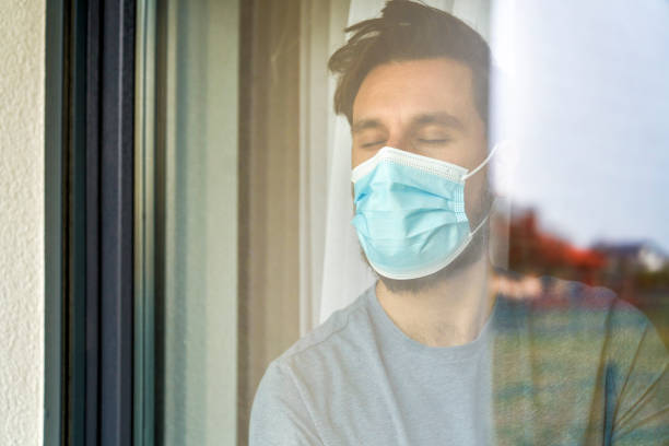 istock Close up of man with closed eyes thirsty for sunlight 1313792196