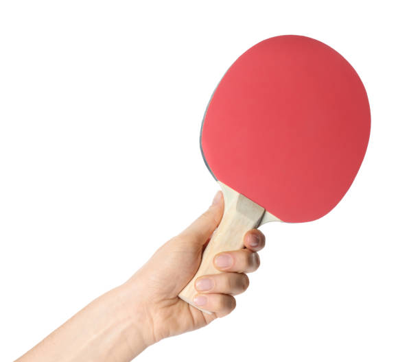 istock Woman holding ping pong racket on white background, closeup 1313792727