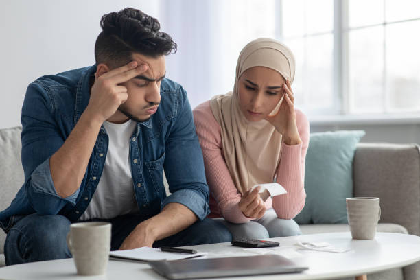istock Puzzled muslim family feeling worry about their spendings 1313793700