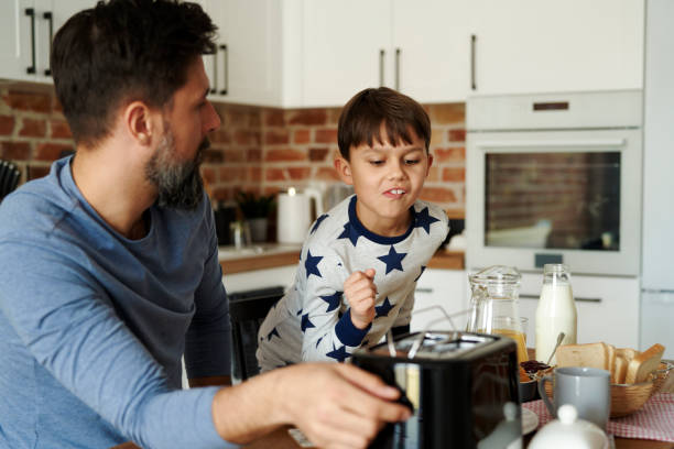 istock Father and son having breakfast in the morning 1313793880