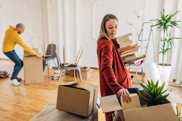 istock Couple unpacking in new home 1313793924